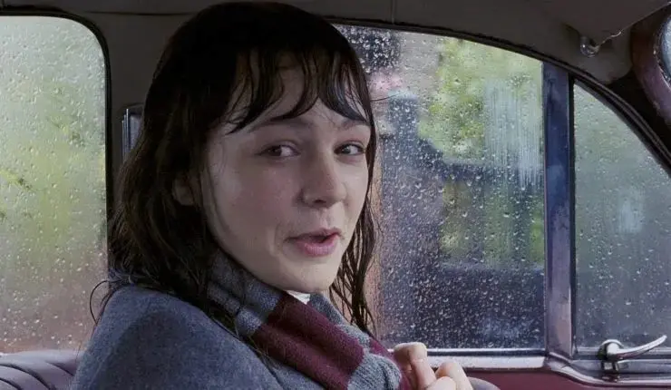 A young woman (Carey Mulligan) is drenched thanks to rain in An Education