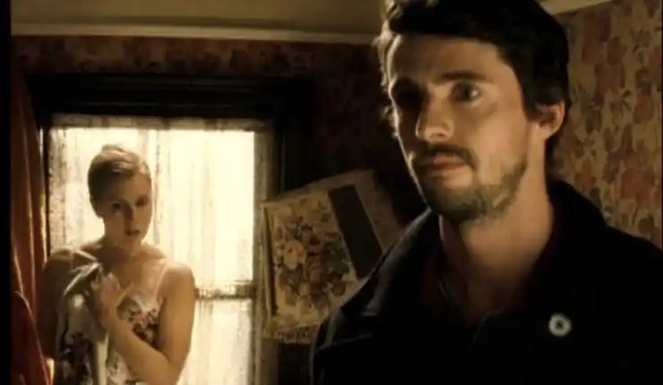 A man stands his back to a woman in white in Leap Year