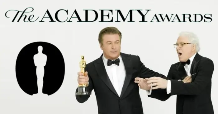 Alec Baldwin and Steve Martin arguw over an Oscar trophy
