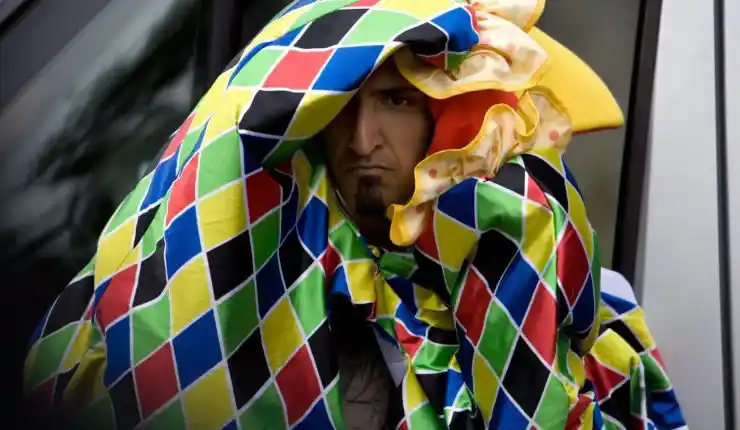 A man hides himself in a Jester suit in Four Lions.