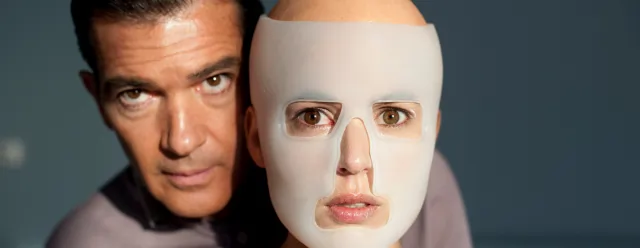 A man stands with a masked woman, Skin I Live In