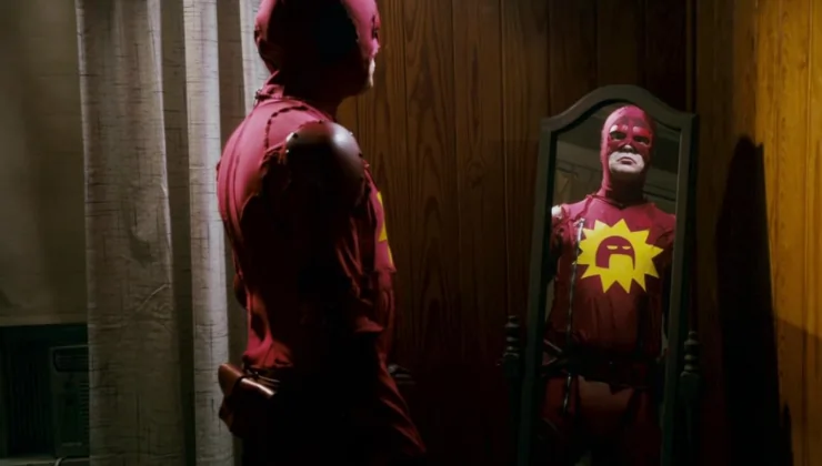 Rainn Wilson is a superhero of types in Super (2010) starring into a mirror