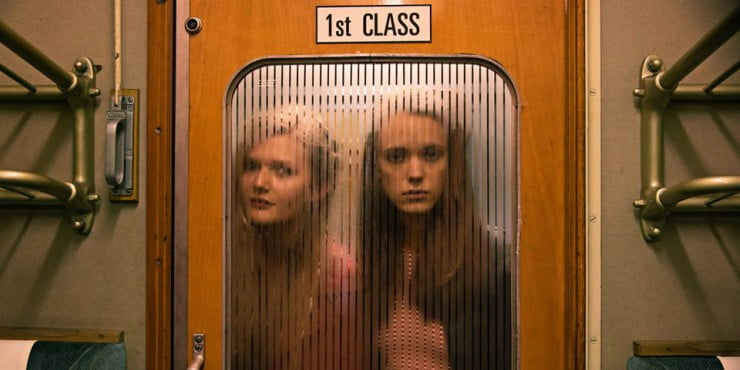 2 young women stare into an train carriage in Nymphomaniac
