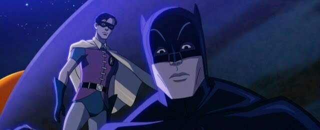 Batman in mask looking puzzled with Robin in background