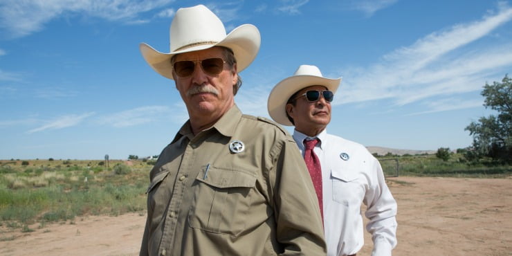A sheriff and deputy stand looking for someone in Hell or High Water