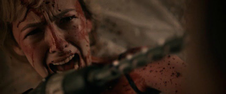 A woman defends herself fron an attack with weapon