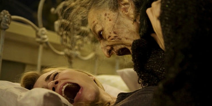 angry old woman screams at terrified younger woman