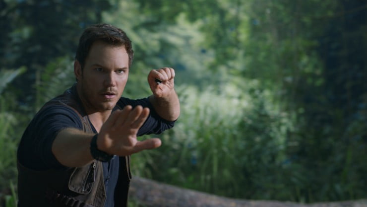 A man tries to control something possibly a dinosaur