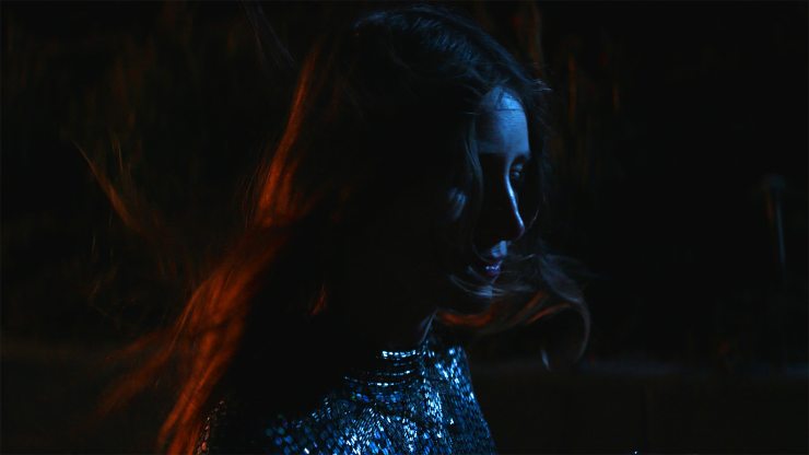 A woman reflects in She Dies Tomorrow