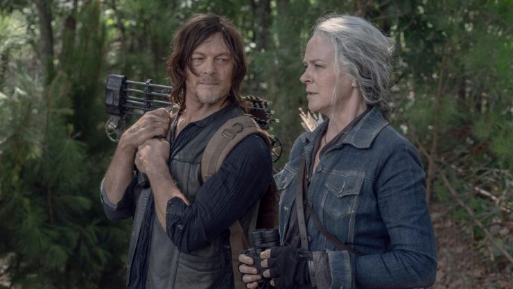 Daryl and Carol stand together chatting in The Walking Dead