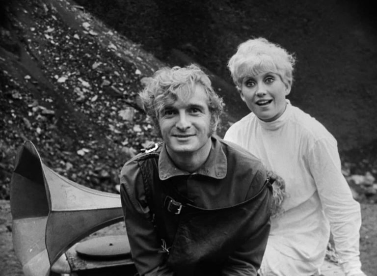a man and woman pose for a photo