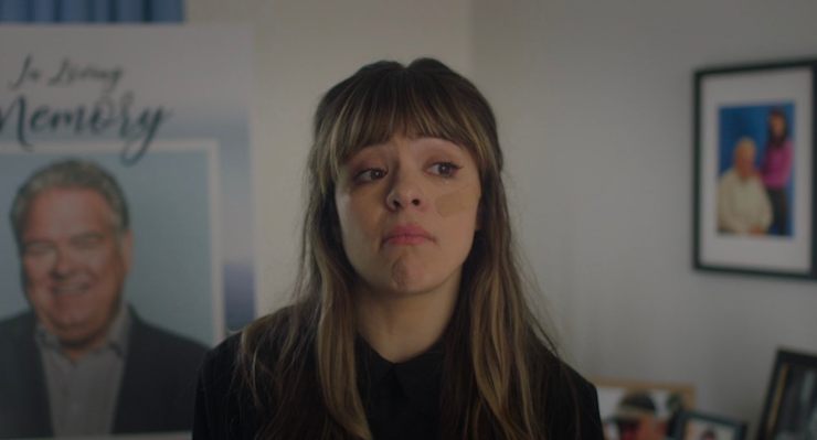 a woman sulks or even daydreams