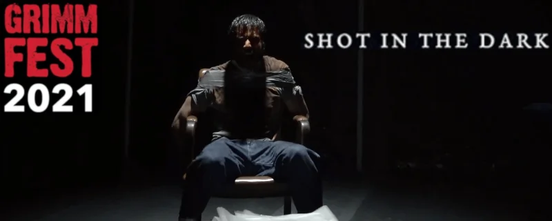 A man tied to the chair in the dark im Shot In The Dark