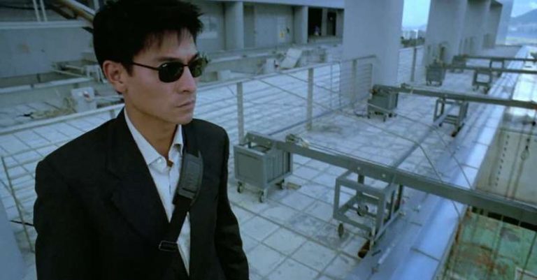From Running out of time (1999) A man in glasses stands on the edge of a building (Andy Lau)