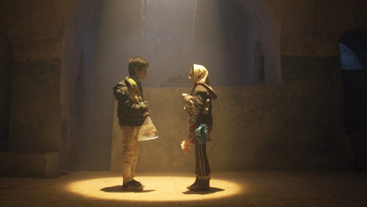 Woman and Boy talk to each other in the spotlight (from film winners)