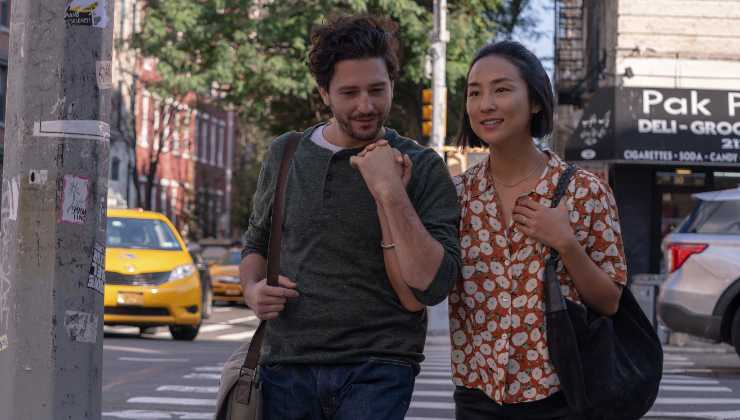 Man and woman happy holding hands together Watch our exclusive video interview with Past Lives director Celine Song