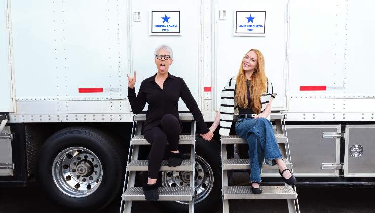 Jamie Lee Curtis and Lindsay Lohan sit on steps posing for The Freaky Friday sequel