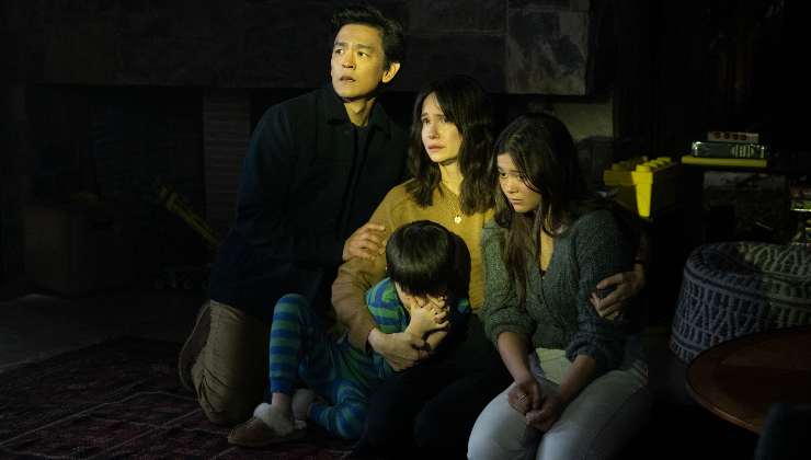A terrified family clam together
