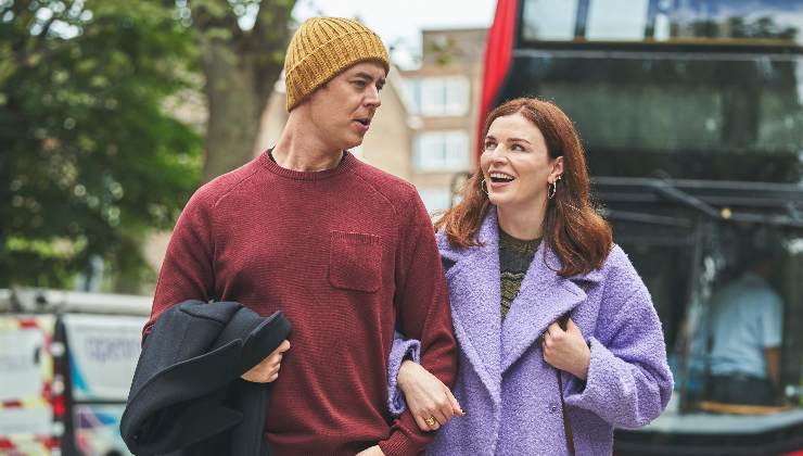 man and woman walk together happy