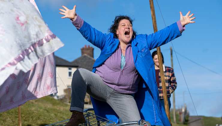 A Joyous, happy woman arms in the air