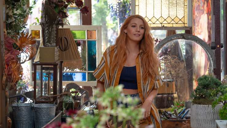 A woman stands in a florist