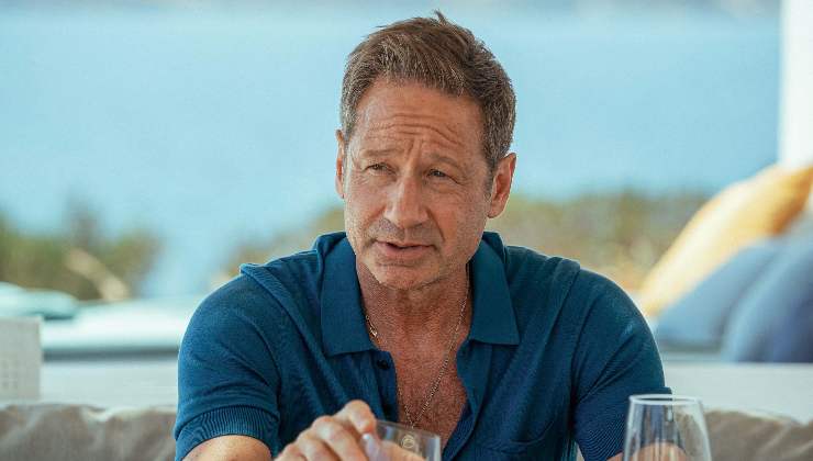A man talks at dinner table