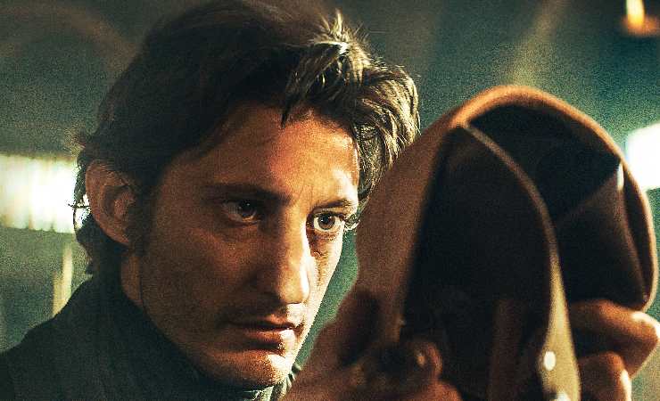 A torn man reflects