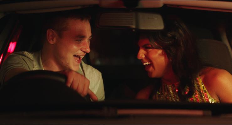 Man and Transwoman laugh in a car , from Unicorns