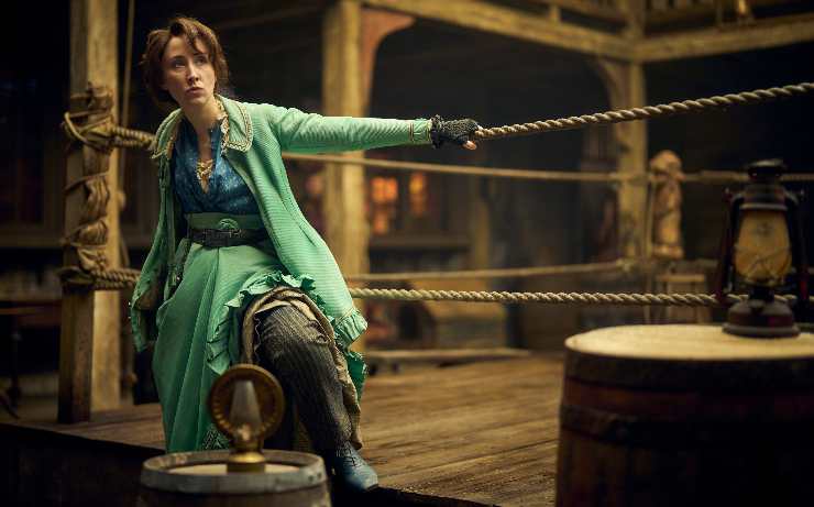 A criminal woman hangs onto a boxing ring rope