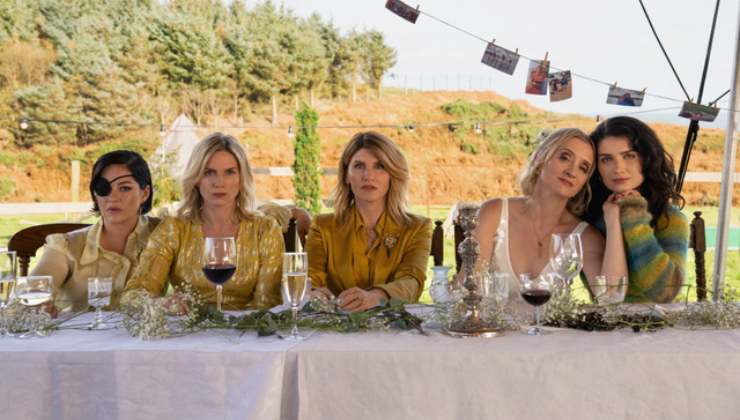 The Gravey sisters sit together having a meal