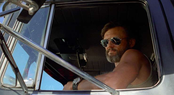 A bearded man in lorry