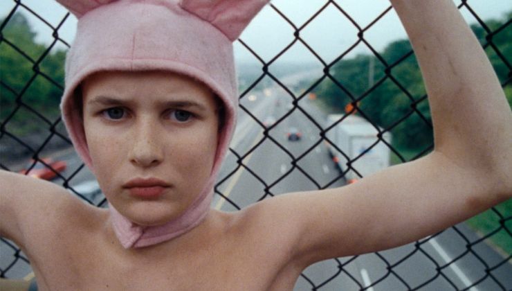 A Young Person standing back to a highway in Gummo