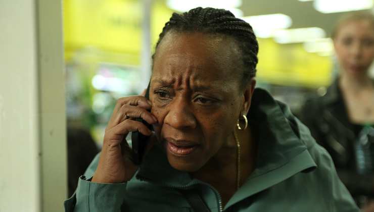 An emotional woman on a mobile (Hard Truths 2025)
