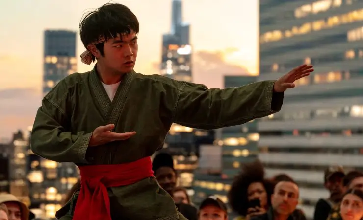 Young boy gets ready for crane kick in The Karate Kid: Legends