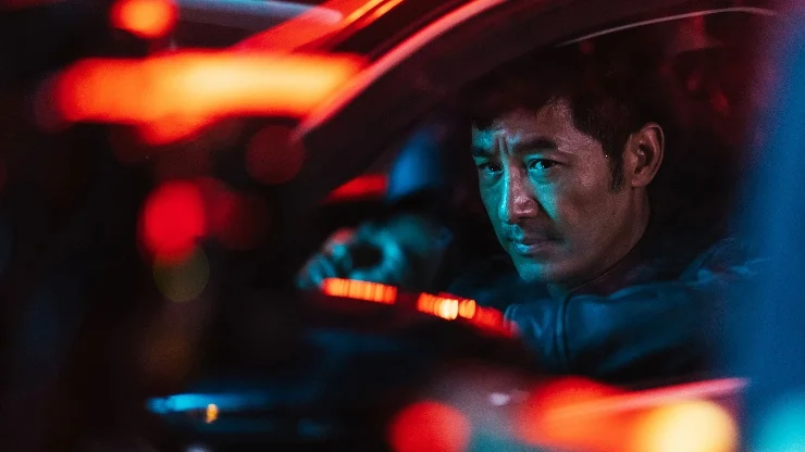 A Chinese man sits in a car looking out in LUZ