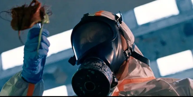Hazmat suit person in Street Trash
