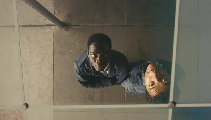 Two Young men look up in Nickel Boys, read Freda Cooper's review