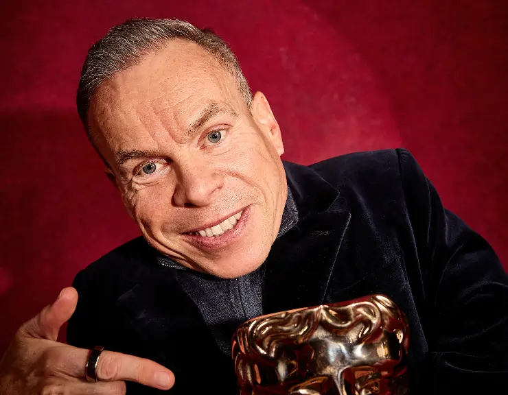 Actor Warwick Davis with a BAFTA Fellowship