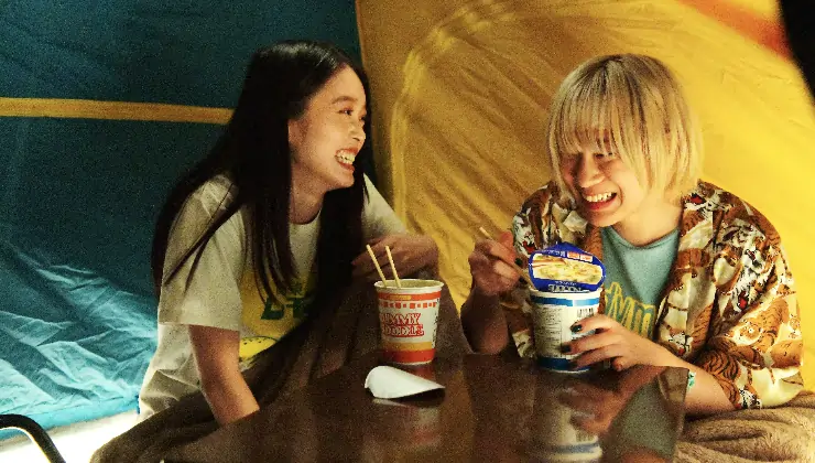 the girls eat Nissin pot noodles in baby Assassins 3