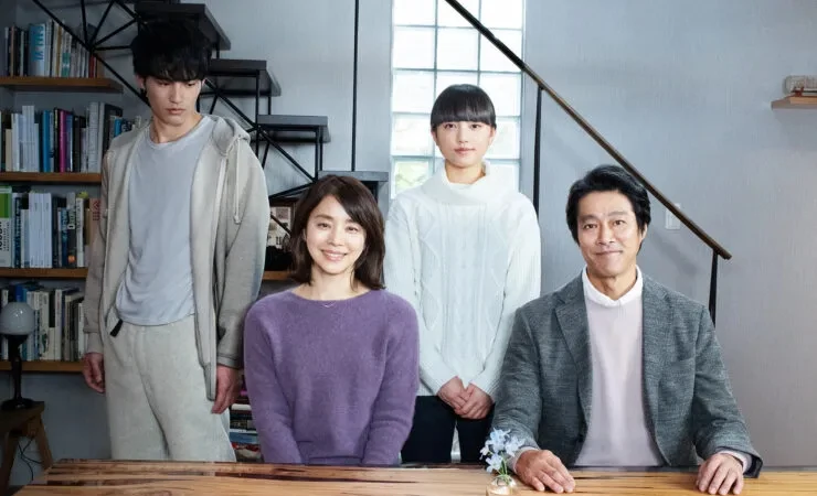 Family pose together in from Japanese Foundation film touring programme