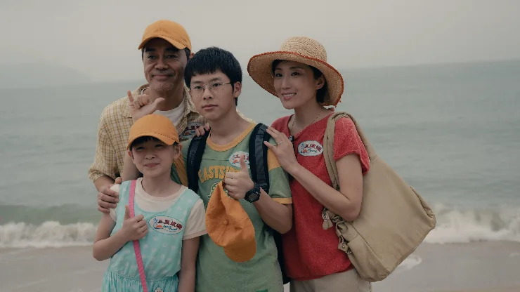 A family pose for photo for Papa in UK Cinemas