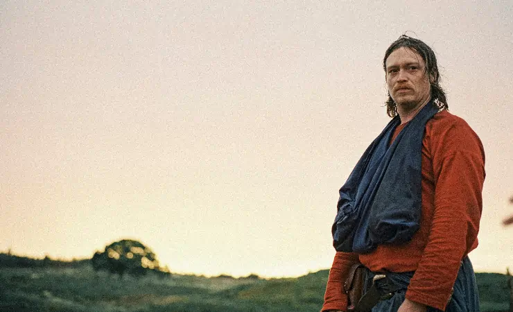 Caleb Landry Jones looks on in Harvest (2025 Mubi)