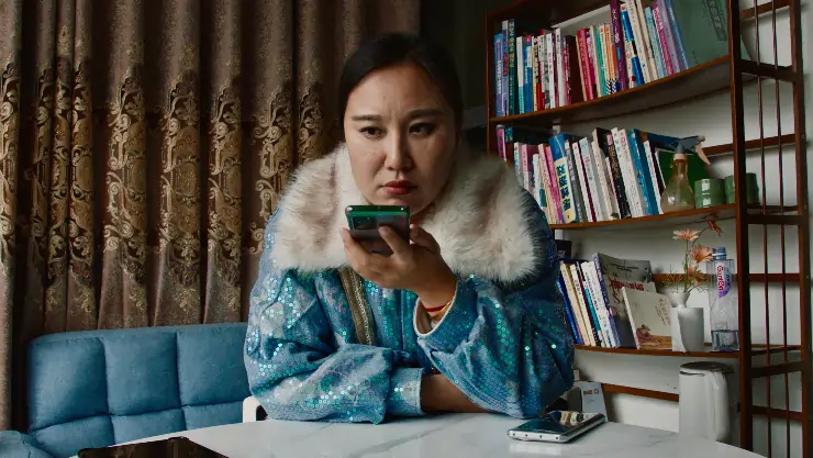 Teacher Wang on mobile phone in Mistress Dispeller