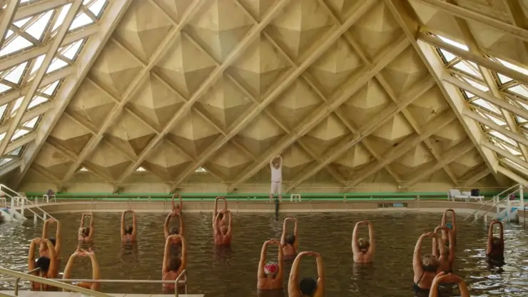 A scene from Sanatorium with many in a pool
