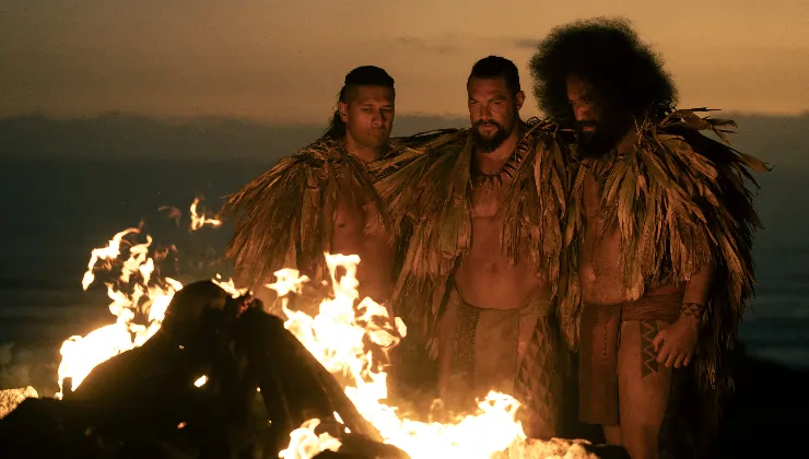 2 Warriors unite together at a log fire in Chief Of War