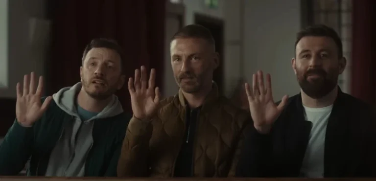3 men sit in a church waving to someone in Four Mothers (BFI)