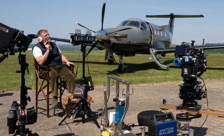 Guy ritchie sits on the set of The Gentlemen season 2