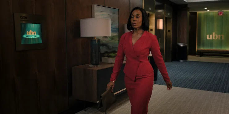 Woman in red dress walks in The Morning Show Season 4