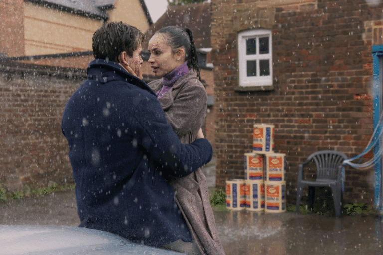 Two lovers embrace in the rain in My Oxford Year