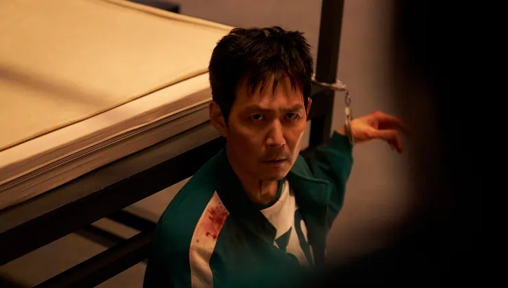 Player 456 aka Gi-Hun is chained to a bed in Squid Game Season 3